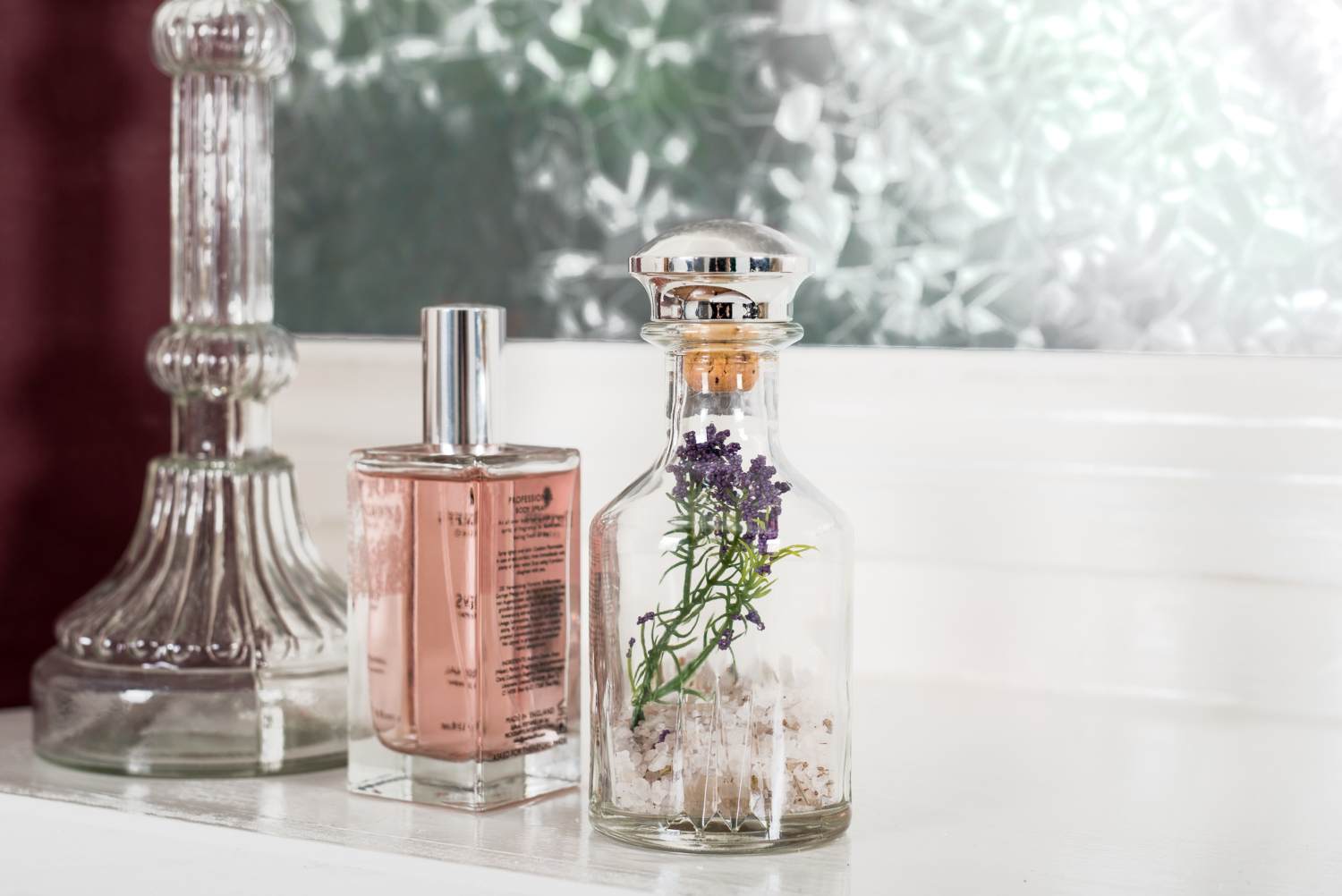 Perfumes and attars in decorative glass bottles.